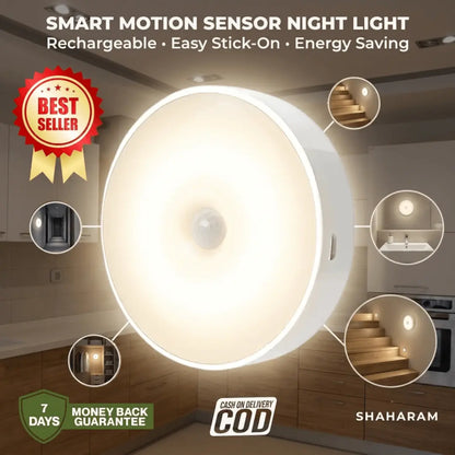 Round white rechargeable smart motion sensor night light glowing with warm light, stick-on LED wall light for stairs, hallway, and home.